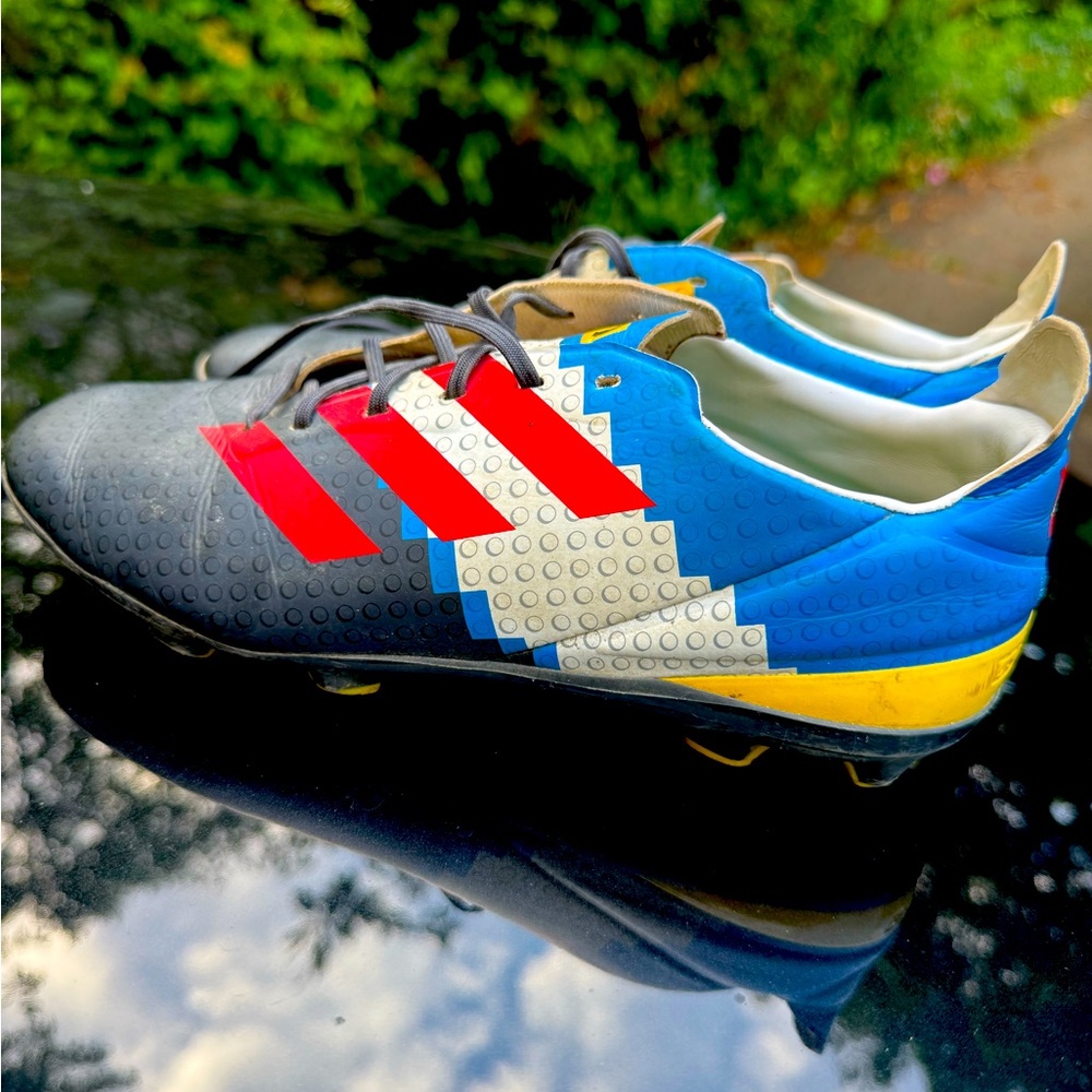 Adidas Black and Blue Soccer Cleats with Red Stripes